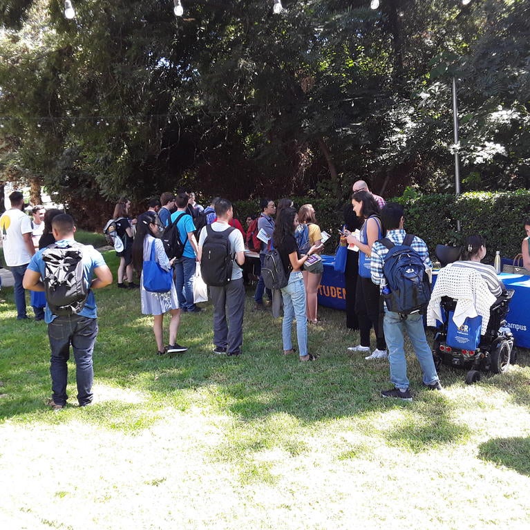 A group of students meetign mentors durring orientation 