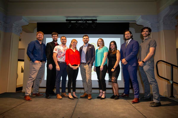 Group of Grad Slam Finalists standing all together on a stage