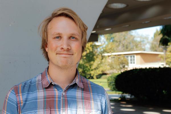 Photo of Kristoffer from shoulders up, smiling