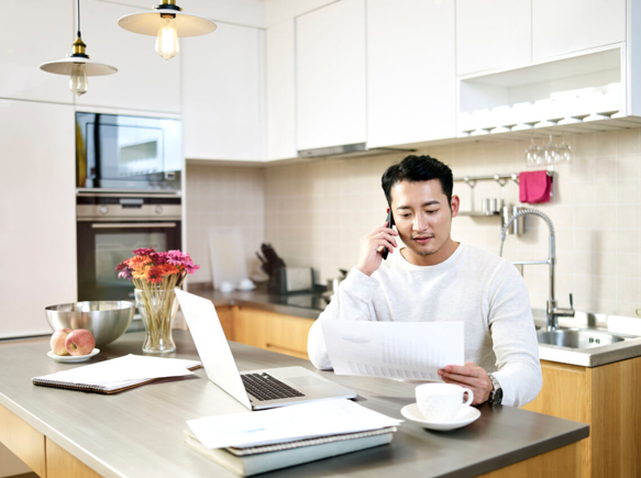 Man working at his kitchen table 