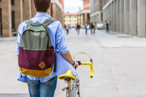 A young man transport to university by bike