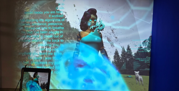 Zoomed-in photograph of an art installation depicting a virtual world where a woman wears blue next to a blue orb