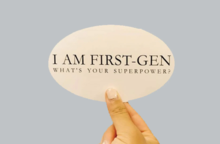 Image of a hand holding up text balloon stating "I am first-gen, what's your superpower?"