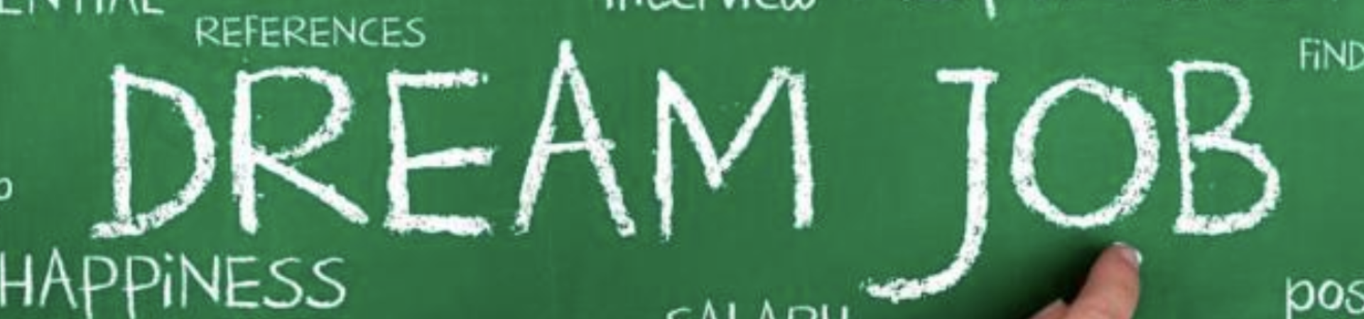 Image shows a person's hand holding chalk and writing "Dream Job" on a chalkboard